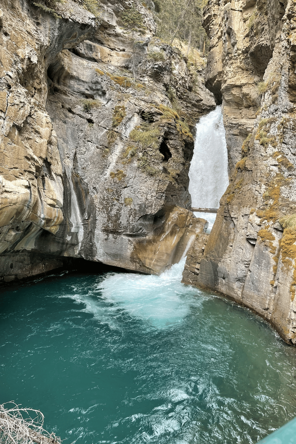Water fall and water with a rock cliff - Johnson Canyon lower falls